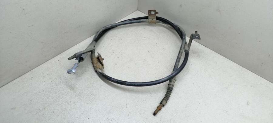 Трос ручника  Nissan Almera N16 хетчбэк 5 дв. 2000г. | Фото № 1   Трос ручника  Nissan Almera N16 хетчбэк 5 дв. 2000г. - Фото 1