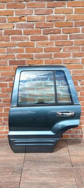 Дверь задняя левая  Jeep Grand Cherokee WJ (1999-2004) 1999г. | Фото № 1   Дверь задняя левая  Jeep Grand Cherokee WJ (1999-2004) 1999г. - Фото 1